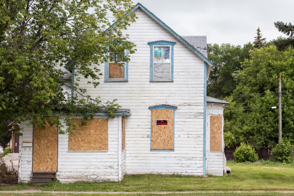 House with boarded windows