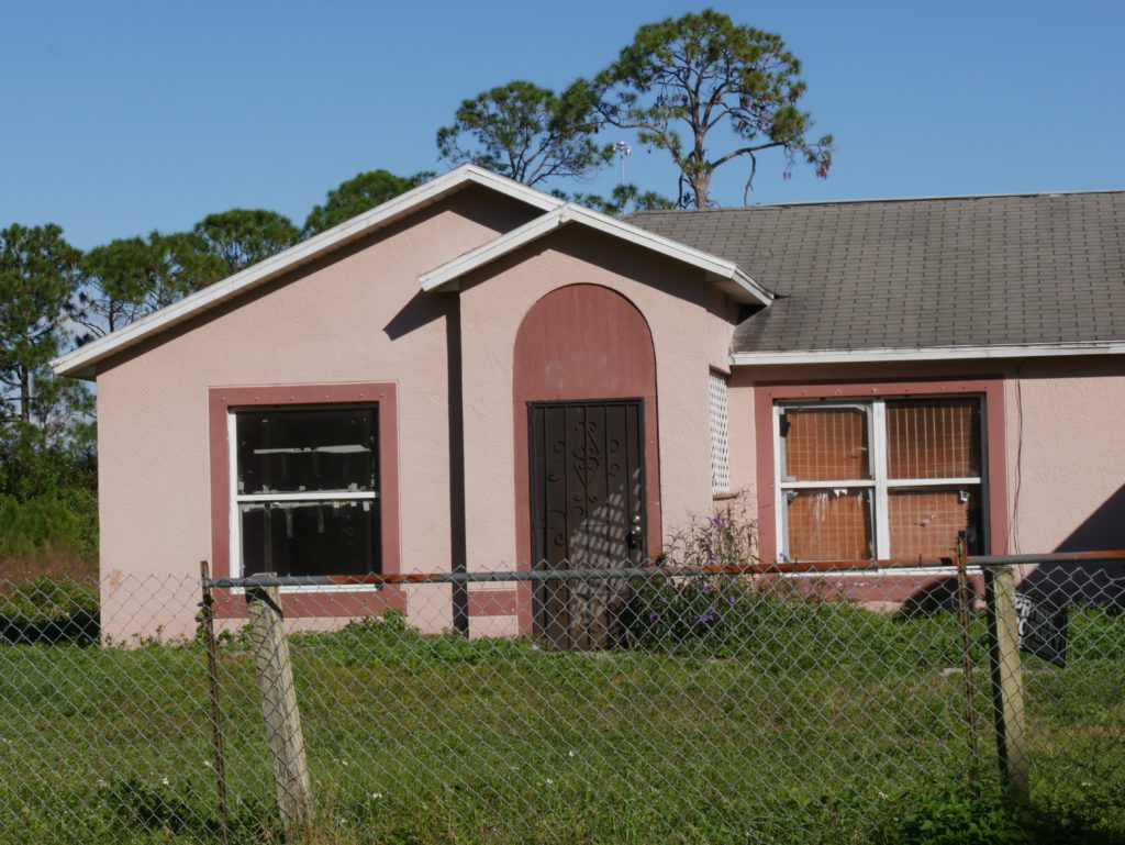 Pink home needed some repairs.